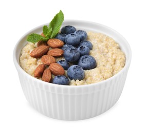 Photo of Bowl of delicious cooked quinoa with almonds and blueberries isolated on white