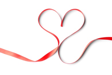 Photo of Heart made of red ribbon on white background, top view. Festive decoration