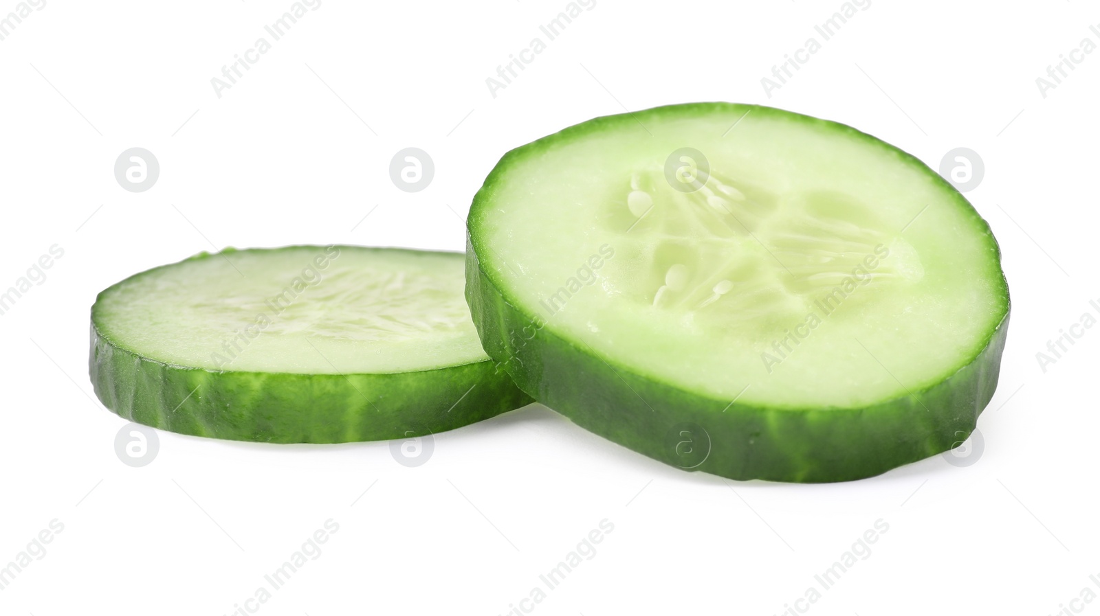 Photo of Slices of fresh cucumber isolated on white