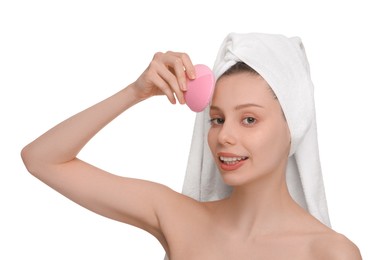 Photo of Washing face. Young woman with cleansing brush on white background