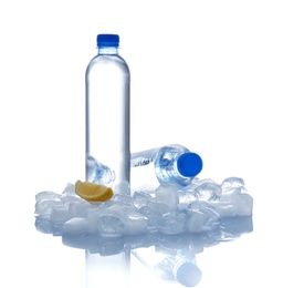 Photo of Bottles of water, lemon slice and ice cubes on white background