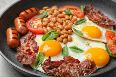 Photo of Closeup view of delicious breakfast with fried eggs