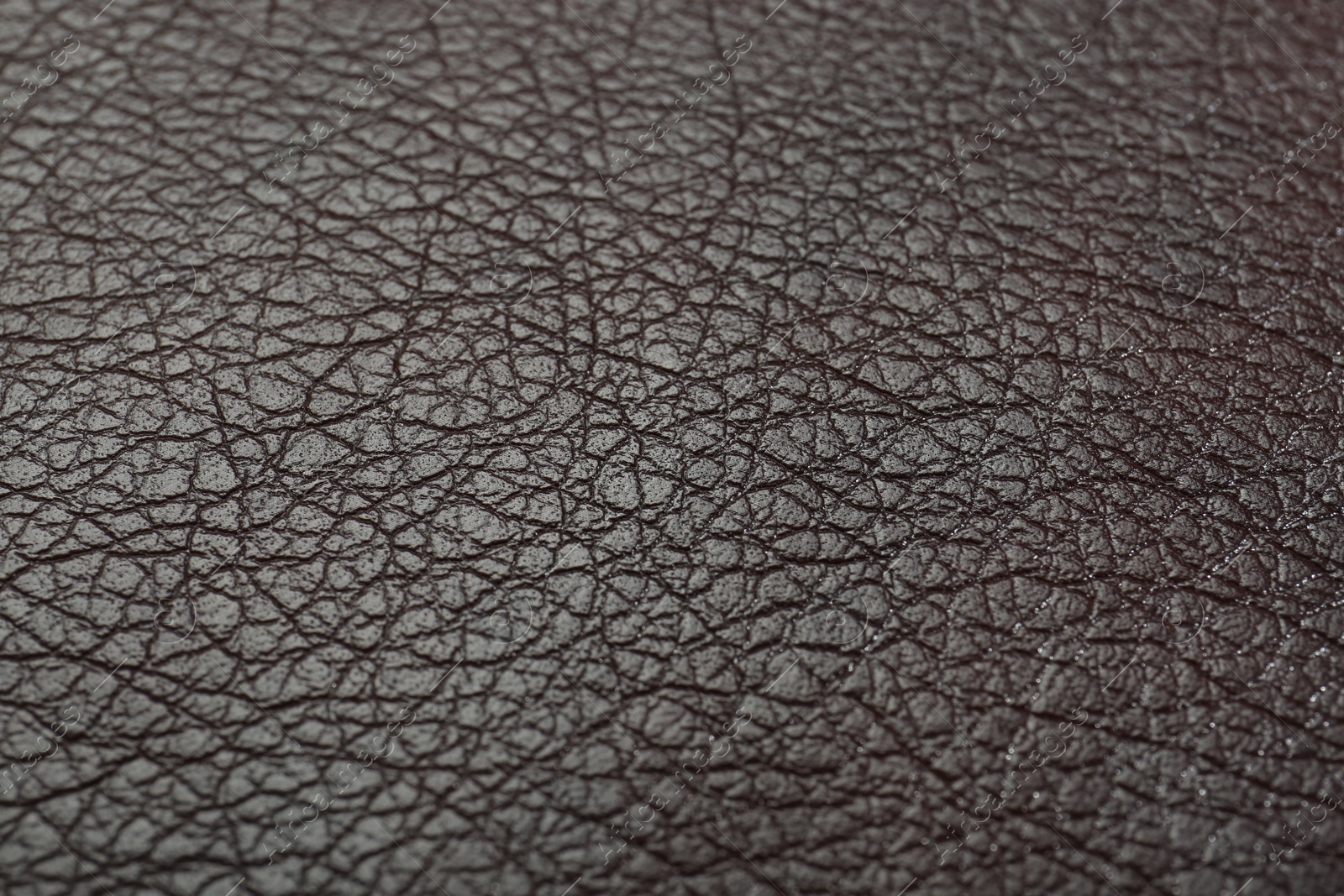 Photo of Texture of brown leather as background, closeup