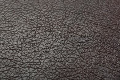 Photo of Texture of brown leather as background, closeup