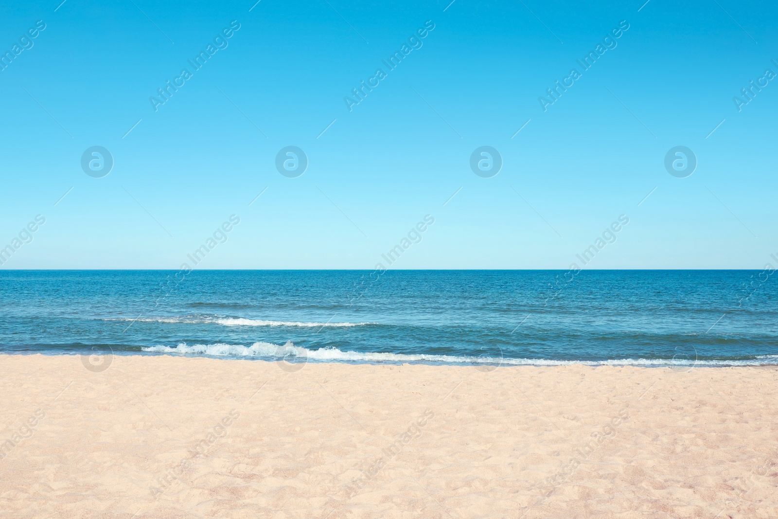 Photo of Picturesque view of sandy beach near sea