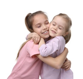 Portrait of cute little sisters on white background