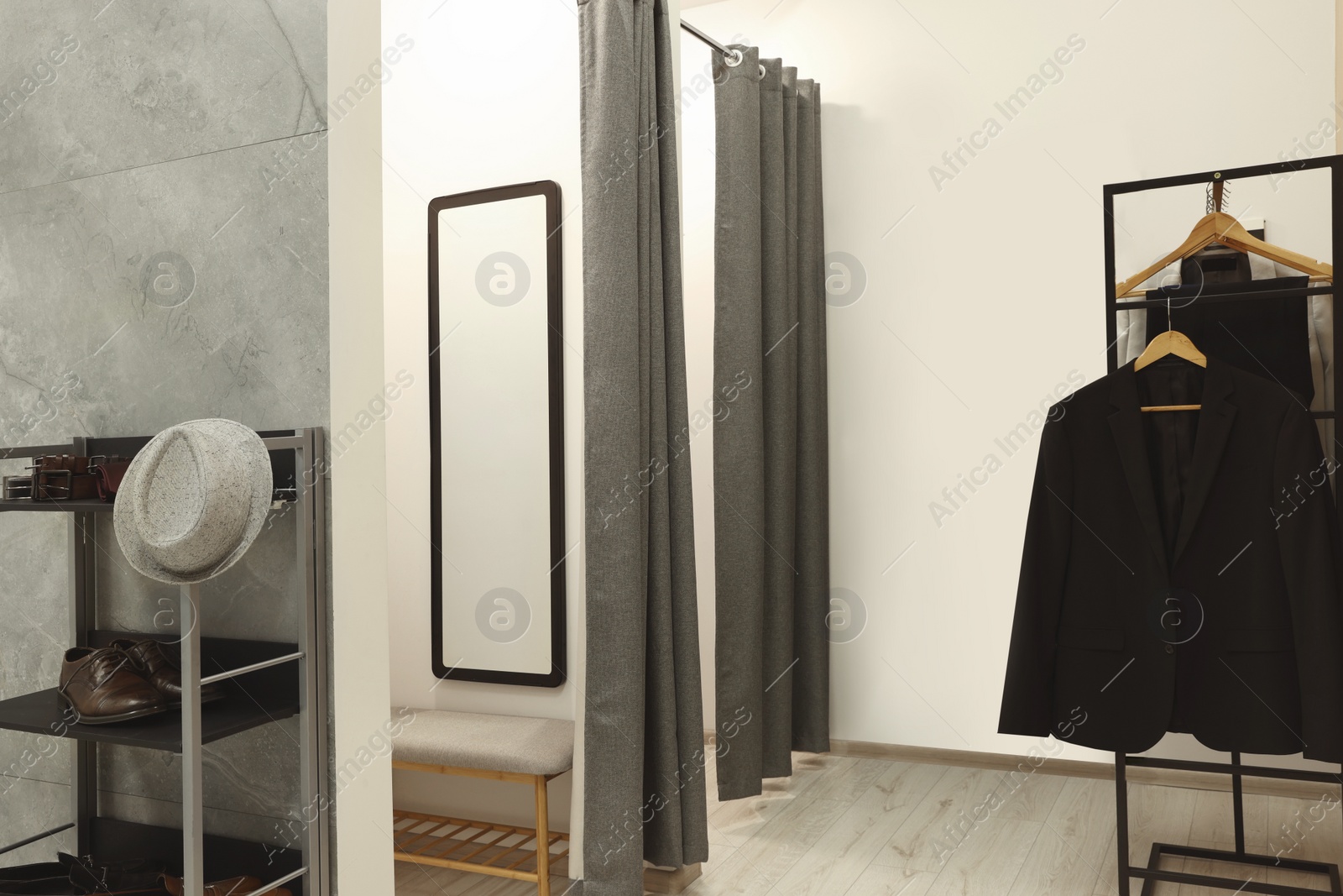 Photo of Dressing room in fashion store. Stylish design