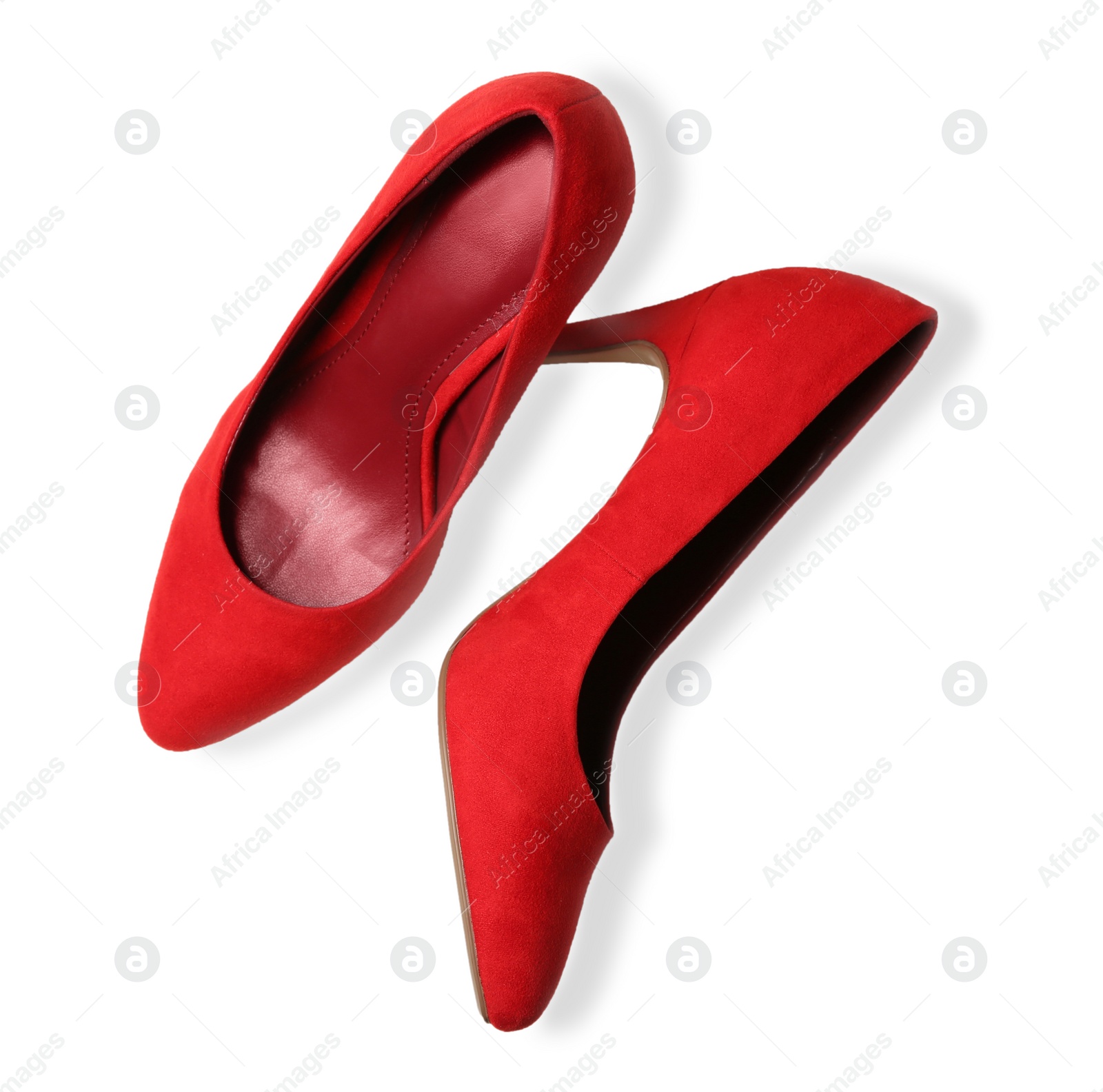 Photo of Pair of red female shoes on white background