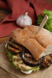 Photo of Delicious fresh eggplant sandwich served on table, closeup