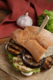 Delicious fresh eggplant sandwich served on table, closeup