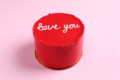 Bento cake with text Love You on pink table. St. Valentine's day surprise