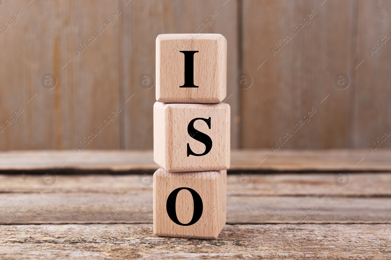 Photo of International Organization for Standardization. Cubes with abbreviation ISO on wooden table