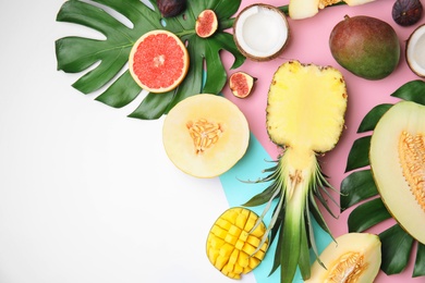 Photo of Flat lay composition with melon, other fruits and space for text on color background