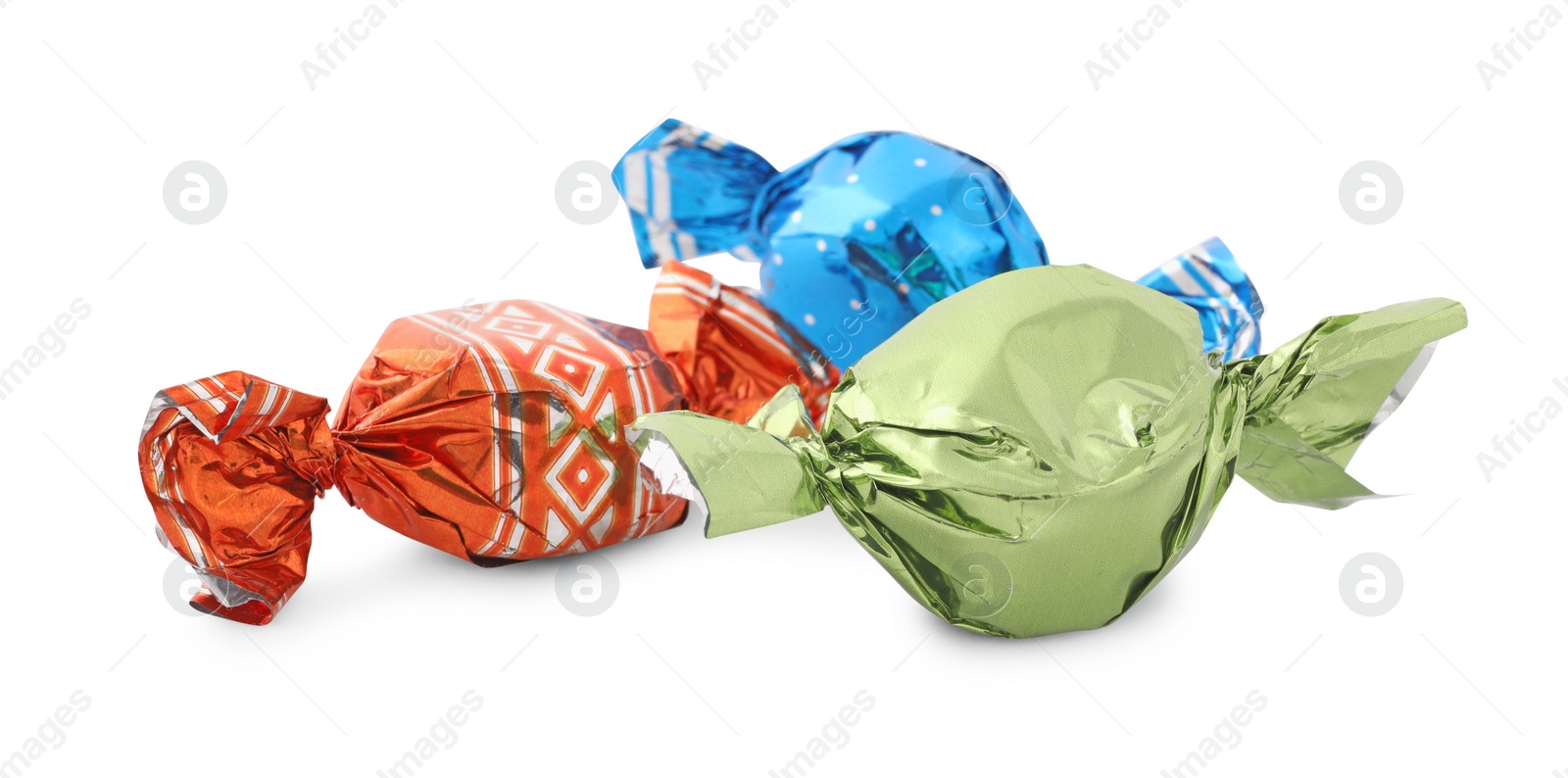 Photo of Sweet candies in colorful wrappers on white background