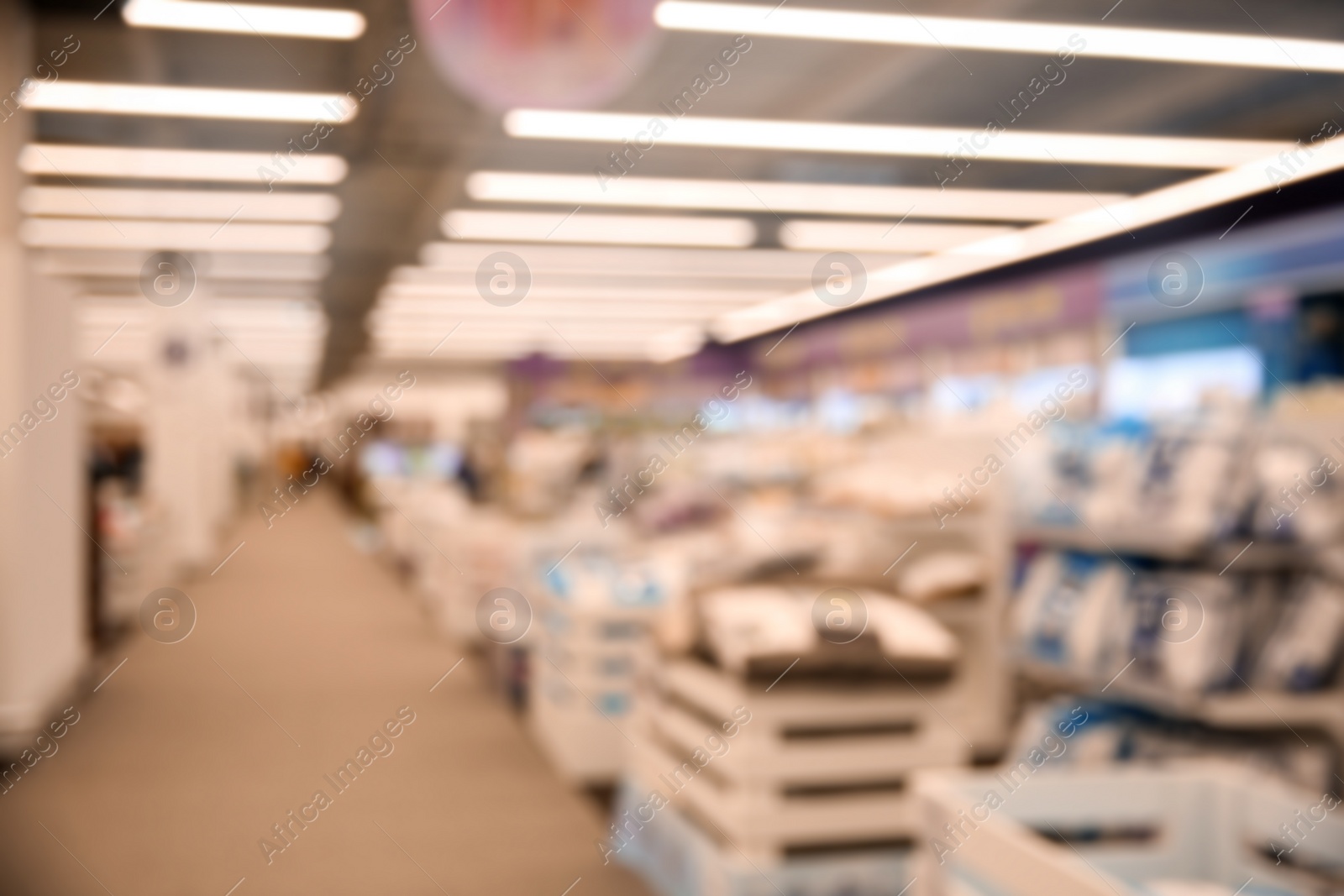 Photo of Blurred view of modern shopping mall interior