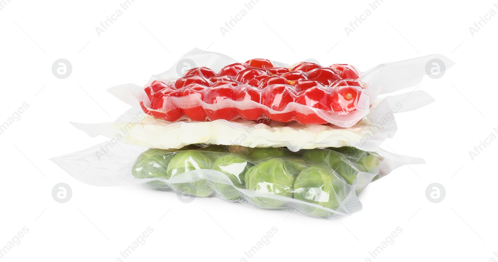 Photo of Stack of vacuum packs with different food products on white background