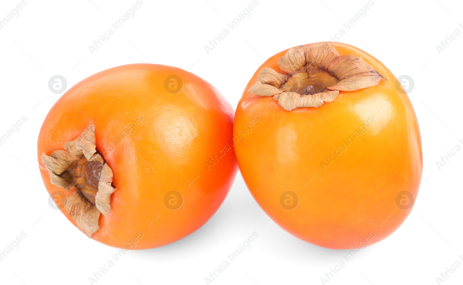 Photo of Delicious ripe juicy persimmons isolated on white