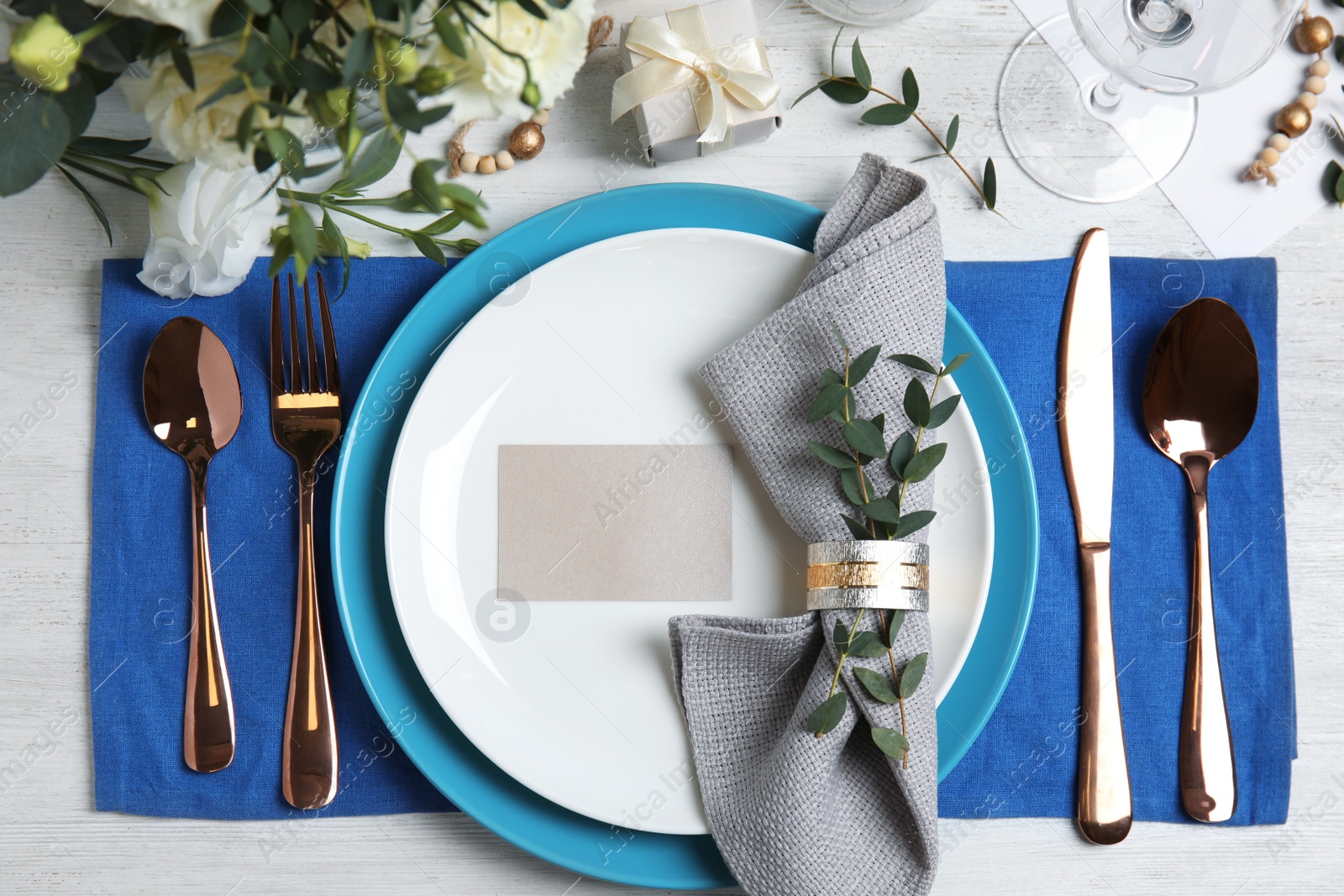 Photo of Elegant festive table setting on white wooden background, flat lay