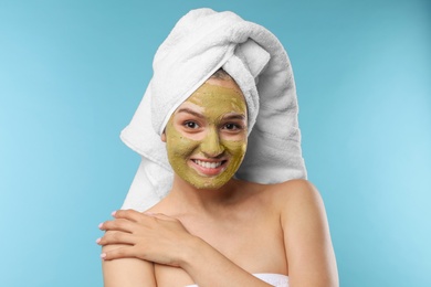 Photo of Beautiful woman with mask on face against color background