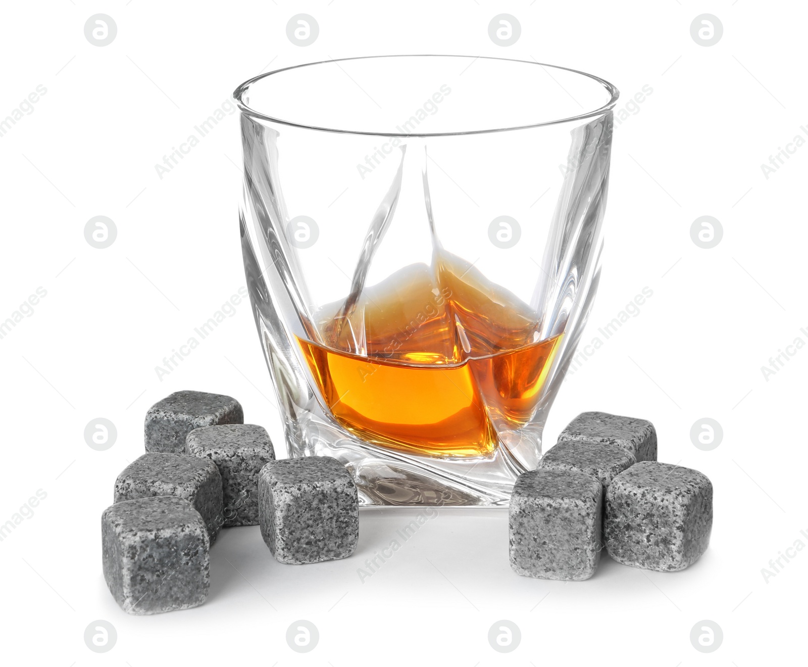 Photo of Glass with liquor and whiskey stones on white background