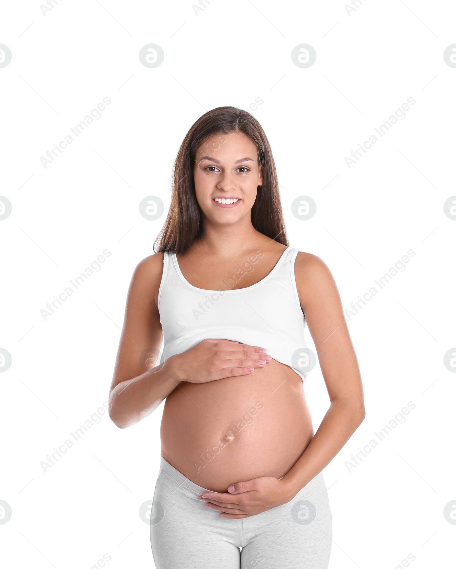 Photo of Happy pregnant woman posing on white background