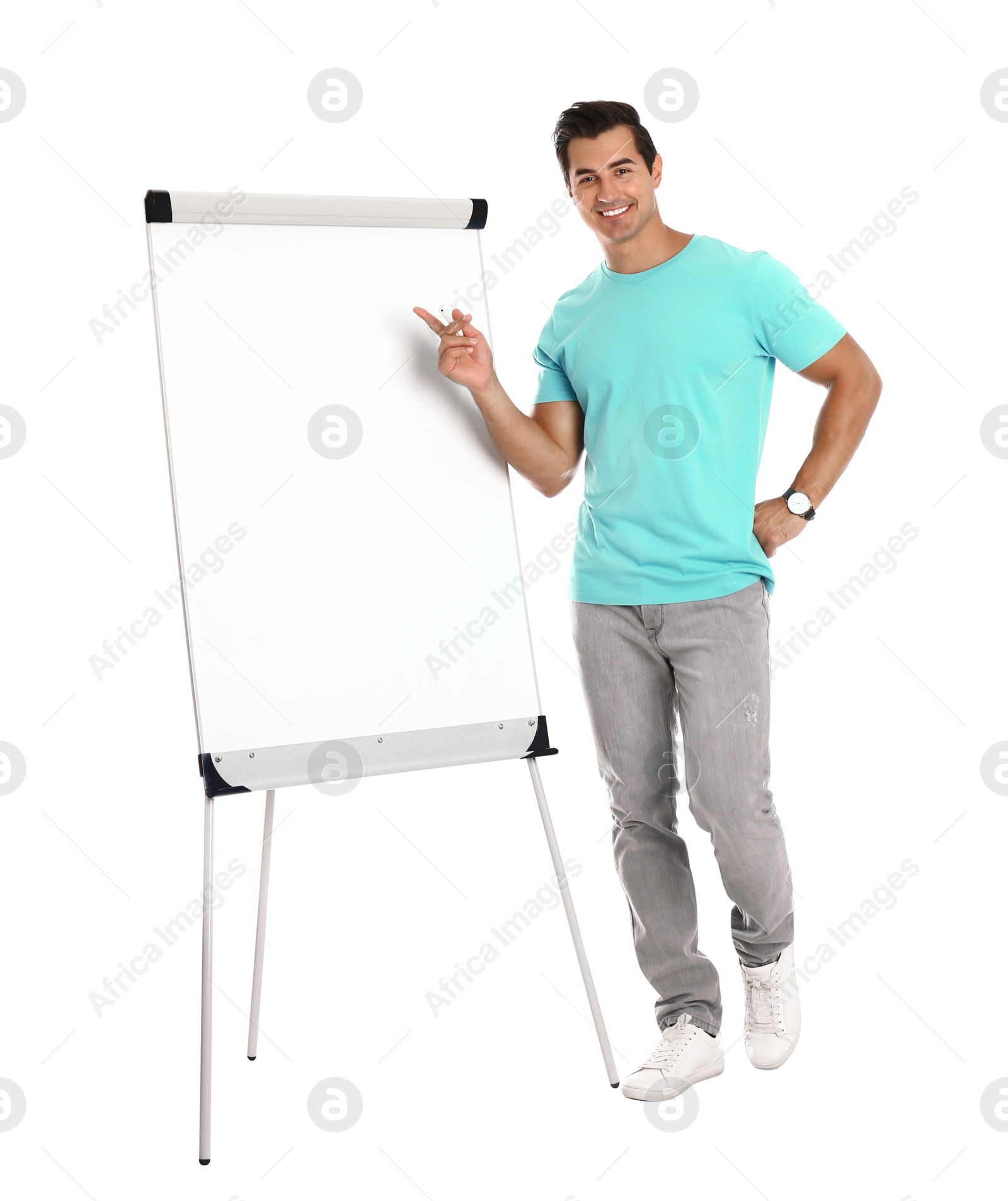Photo of Professional business trainer near flip chart on white background