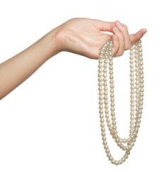 Woman holding elegant pearl necklace on white background, closeup