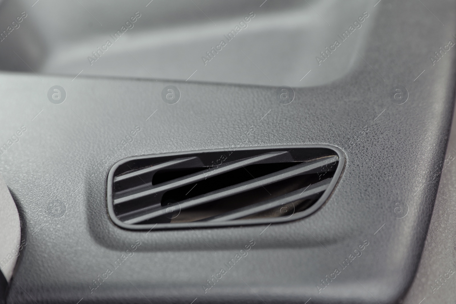 Photo of Air conditioner system in modern car, closeup