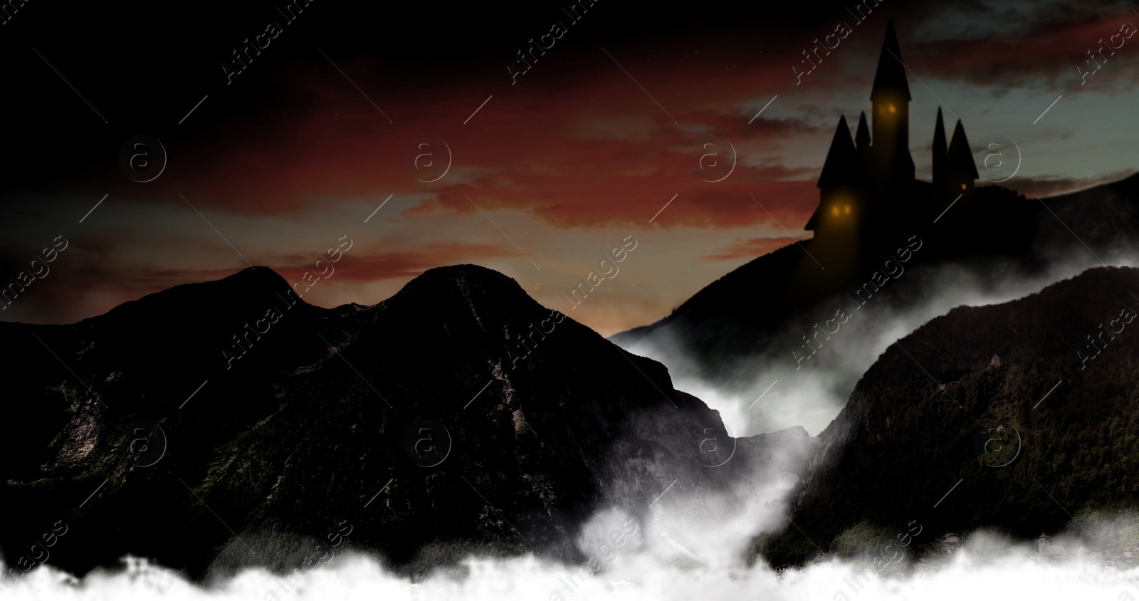 Image of Fantasy world. Mystical castle and mountains covering with fog in night