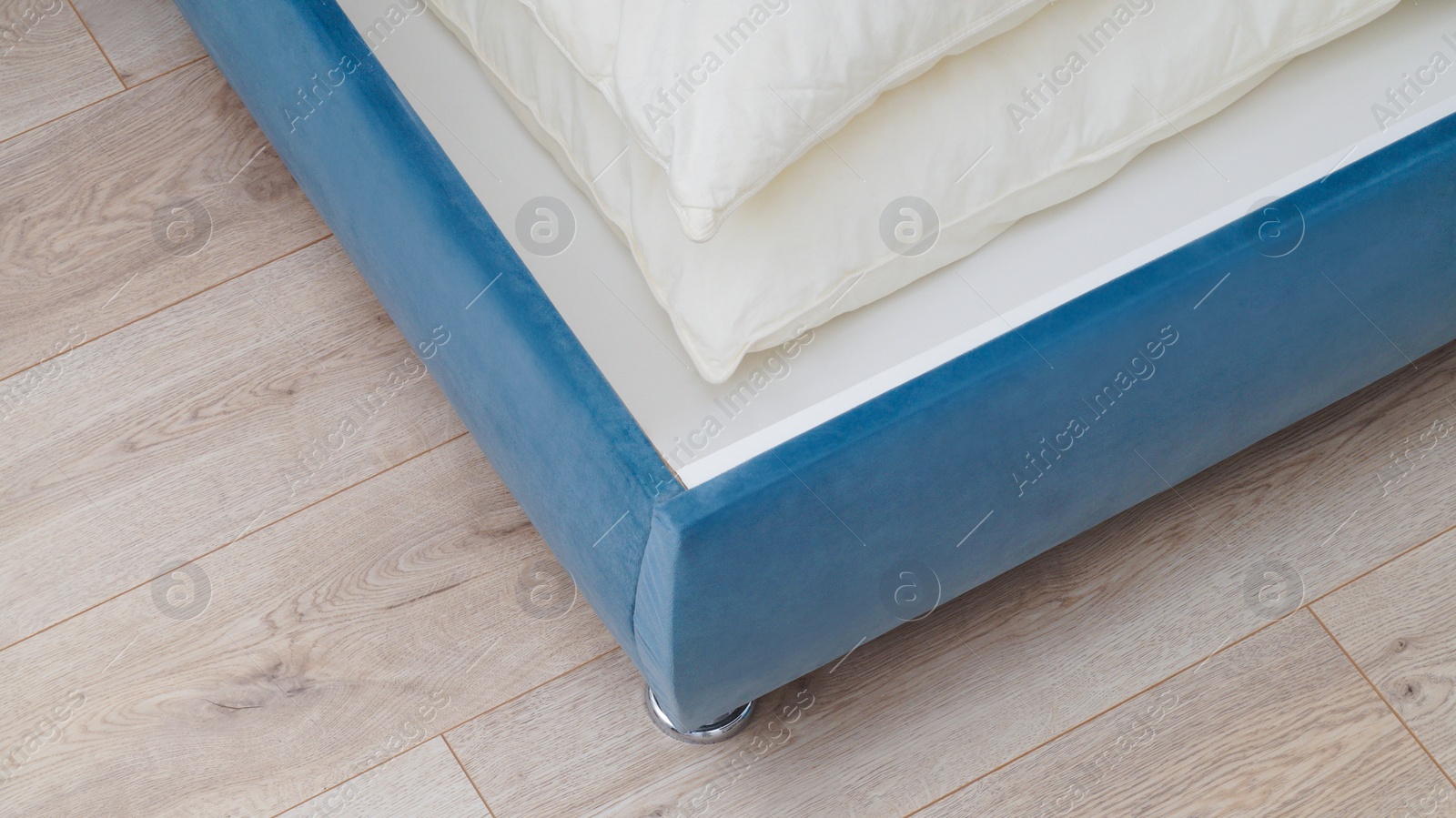 Photo of Storage drawer under bed with white pillows indoors, above view