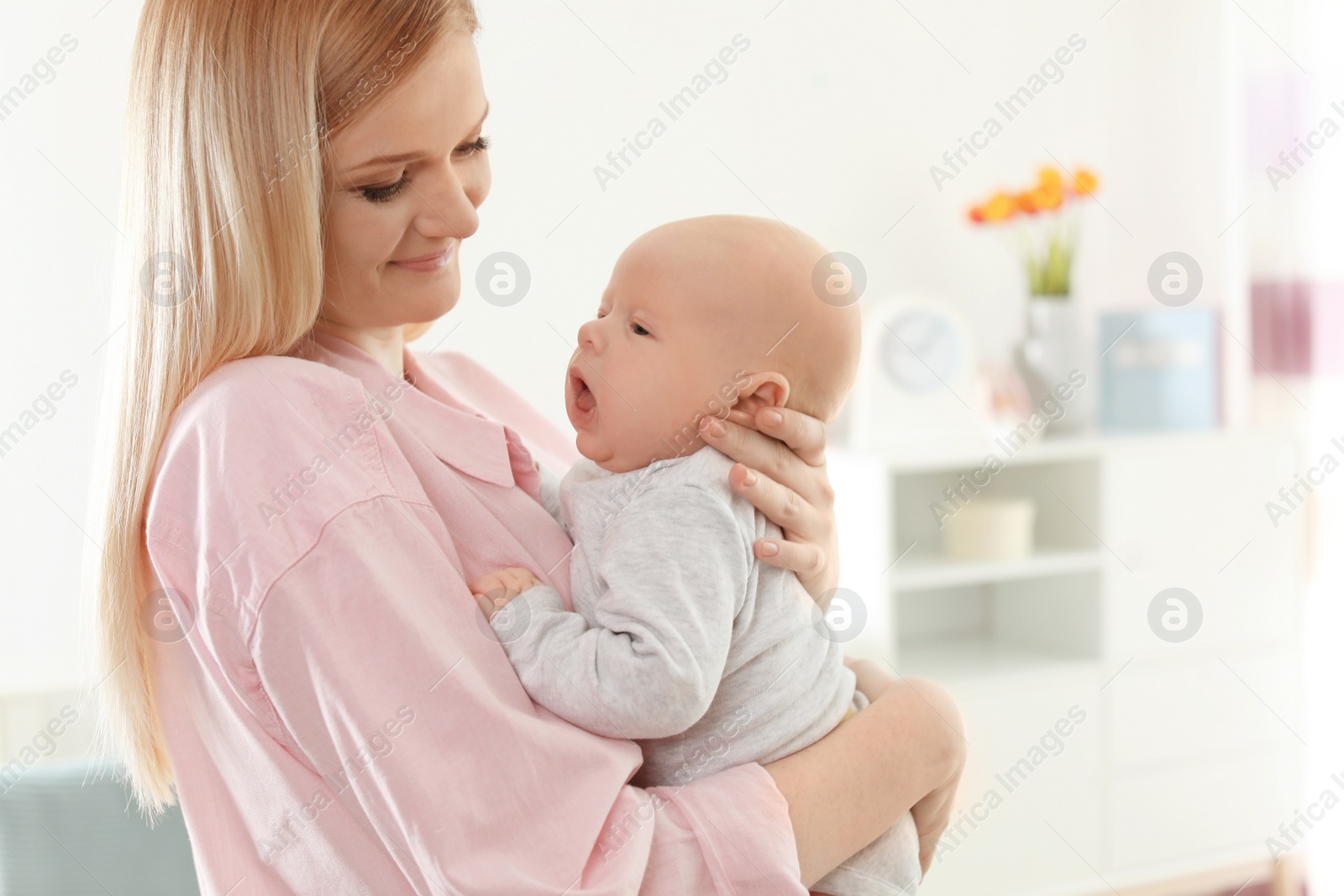 Photo of Happy mother and her baby at home
