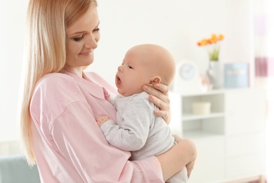 Happy mother and her baby at home