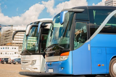 Photo of Public transport station with modern buses on sunny day