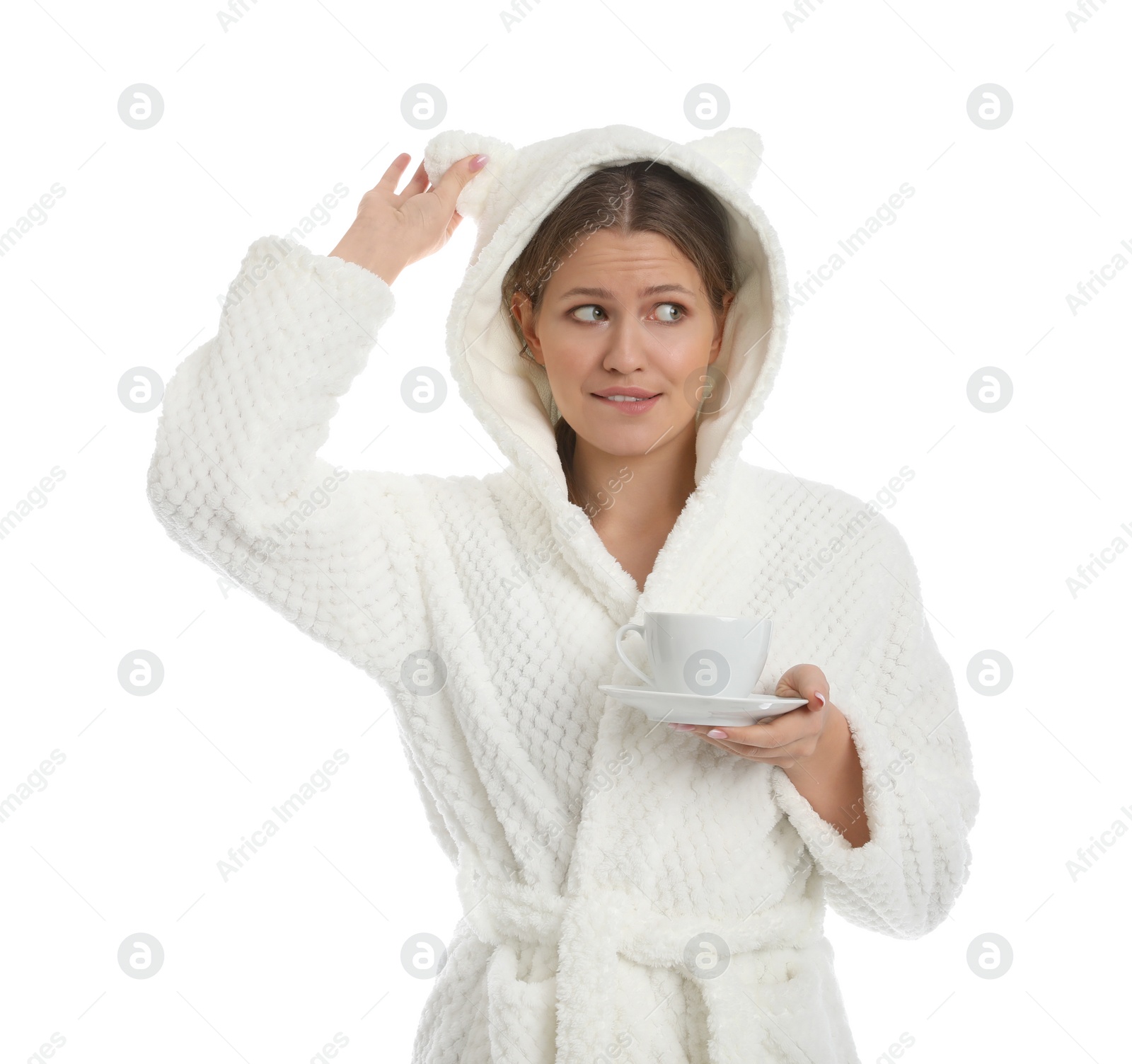 Photo of Young woman in bathrobe with cup of beverage on white background