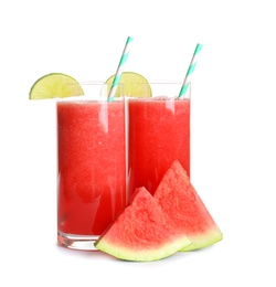 Photo of Tasty summer watermelon drink in glasses and slices of fresh fruit on white background