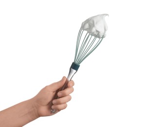 Photo of Woman holding whisk with whipped cream on white background, closeup