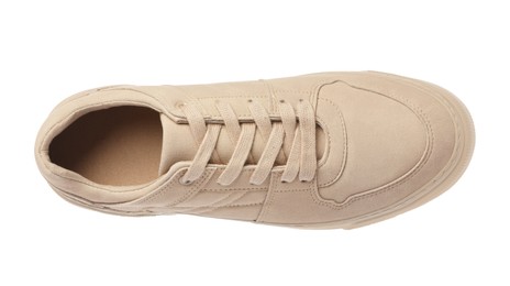 One stylish beige sneaker isolated on white