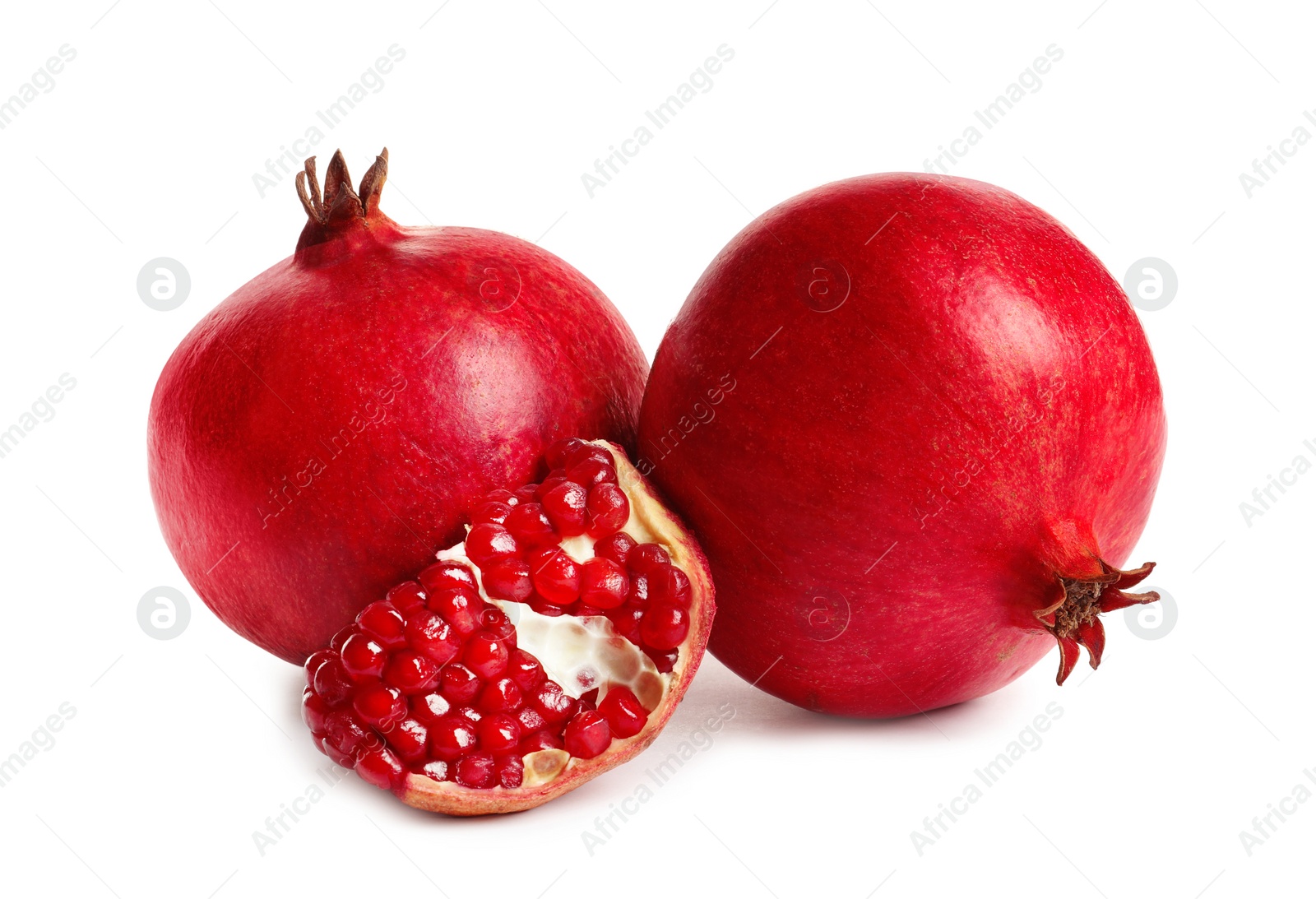 Photo of Ripe fresh pomegranate fruits on white background