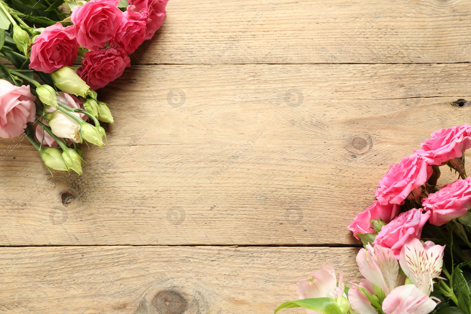 Photo of Happy Mother's Day. Beautiful flowers on wooden table, flat lay. Space for text