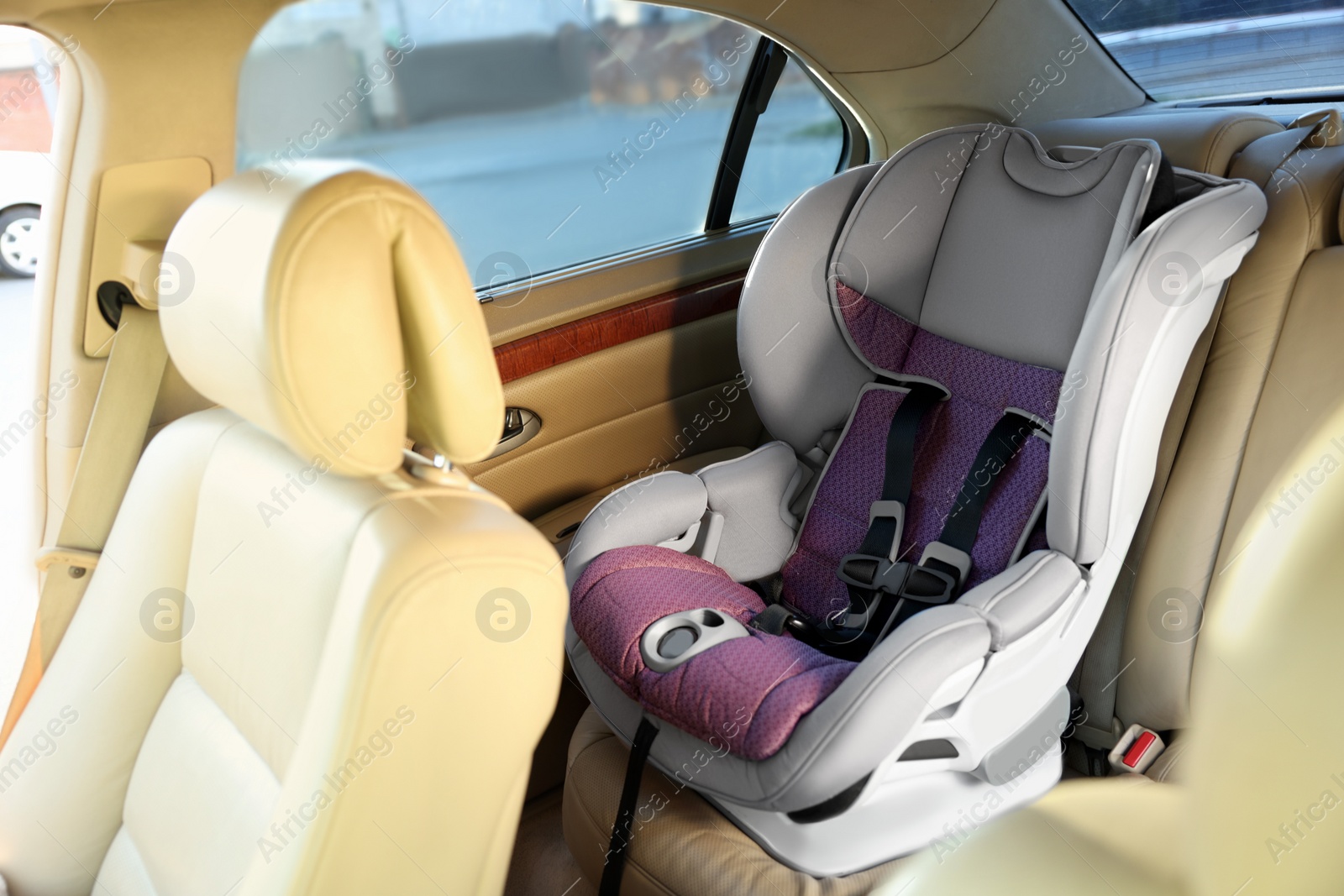 Photo of Empty modern child safety seat inside car