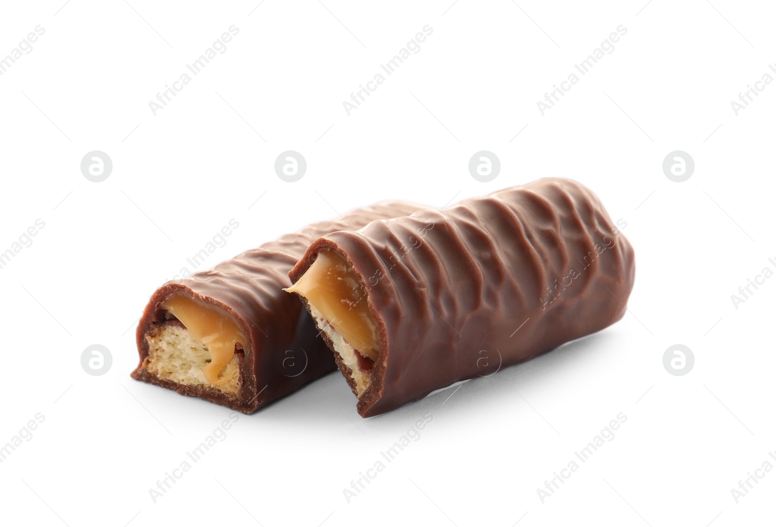 Photo of Pieces of chocolate bar with caramel on white background