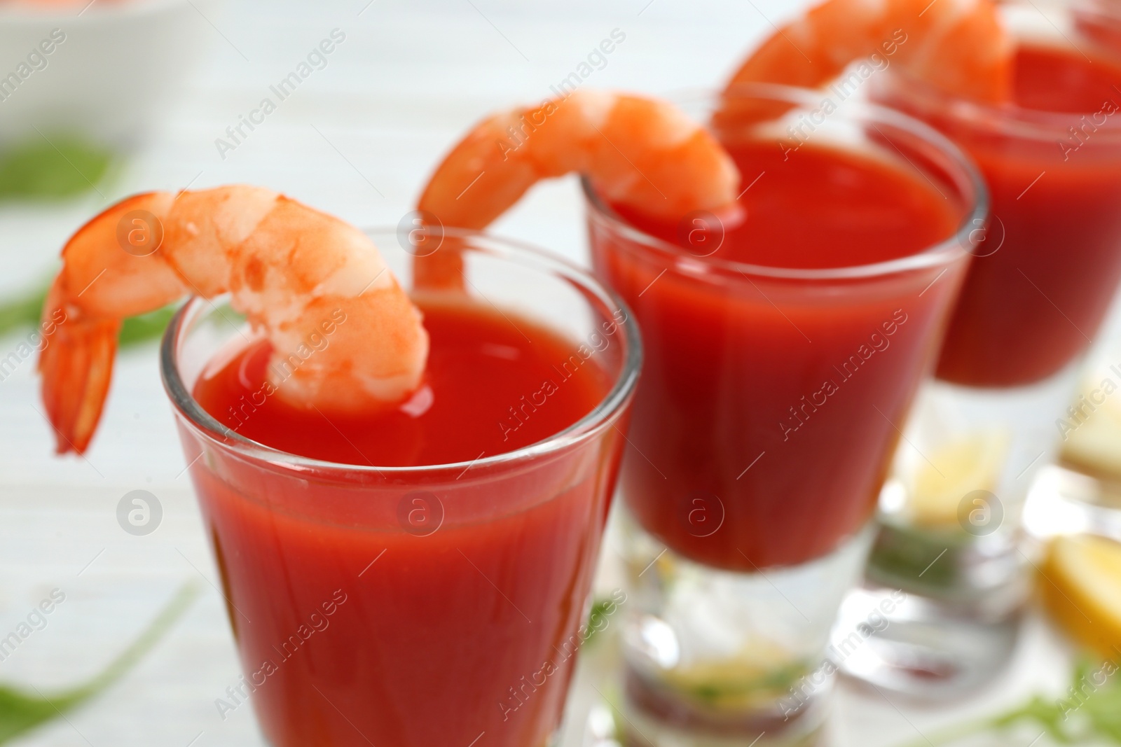 Photo of Delicious shrimp cocktail with tomato sauce, closeup