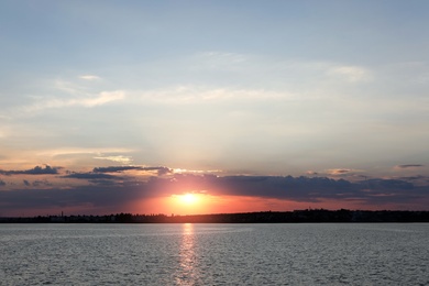 Picturesque view of beautiful sunrise on riverside. Morning sky