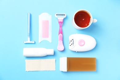 Set for epilation on color background, flat lay