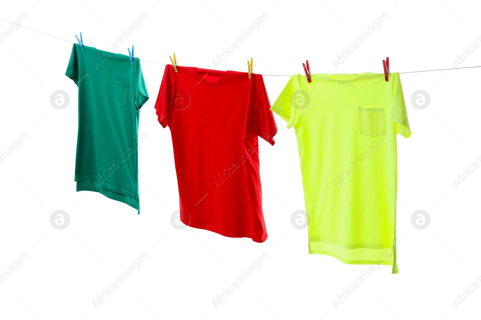 Photo of Colorful t-shirts drying on washing line isolated on white