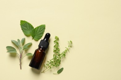 Photo of Bottle of essential oil and different herbs on beige background, flat lay. Space for text