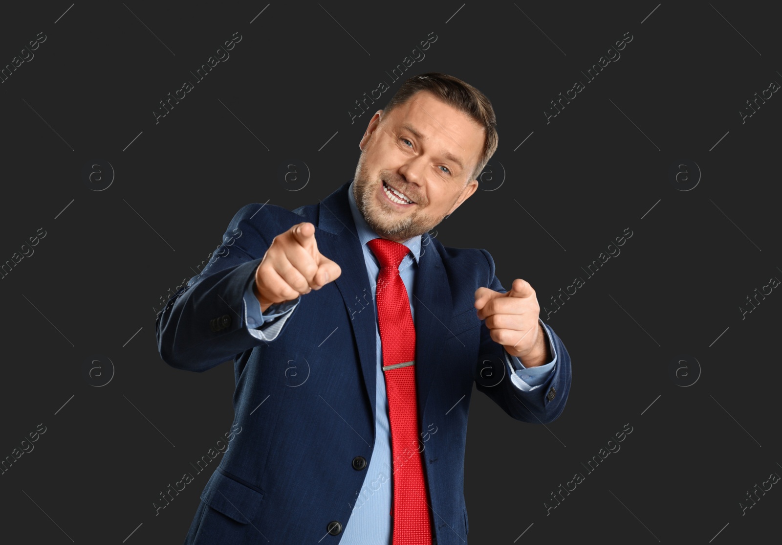 Photo of Portrait of happy mature man on black background