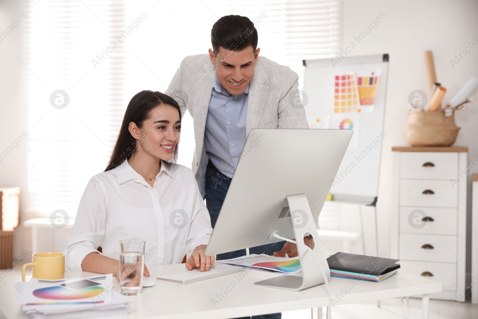 Photo of Professional designers working together in modern office
