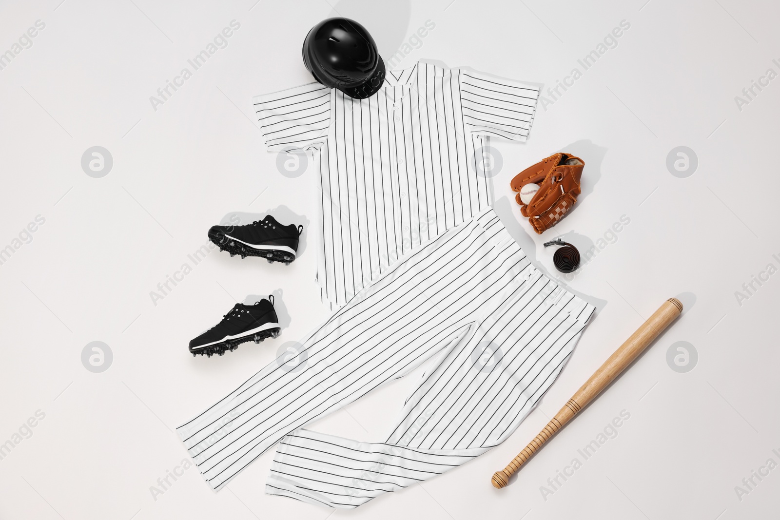 Photo of Flat lay composition with baseball uniform on white background