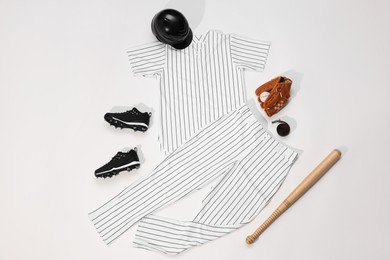 Flat lay composition with baseball uniform on white background